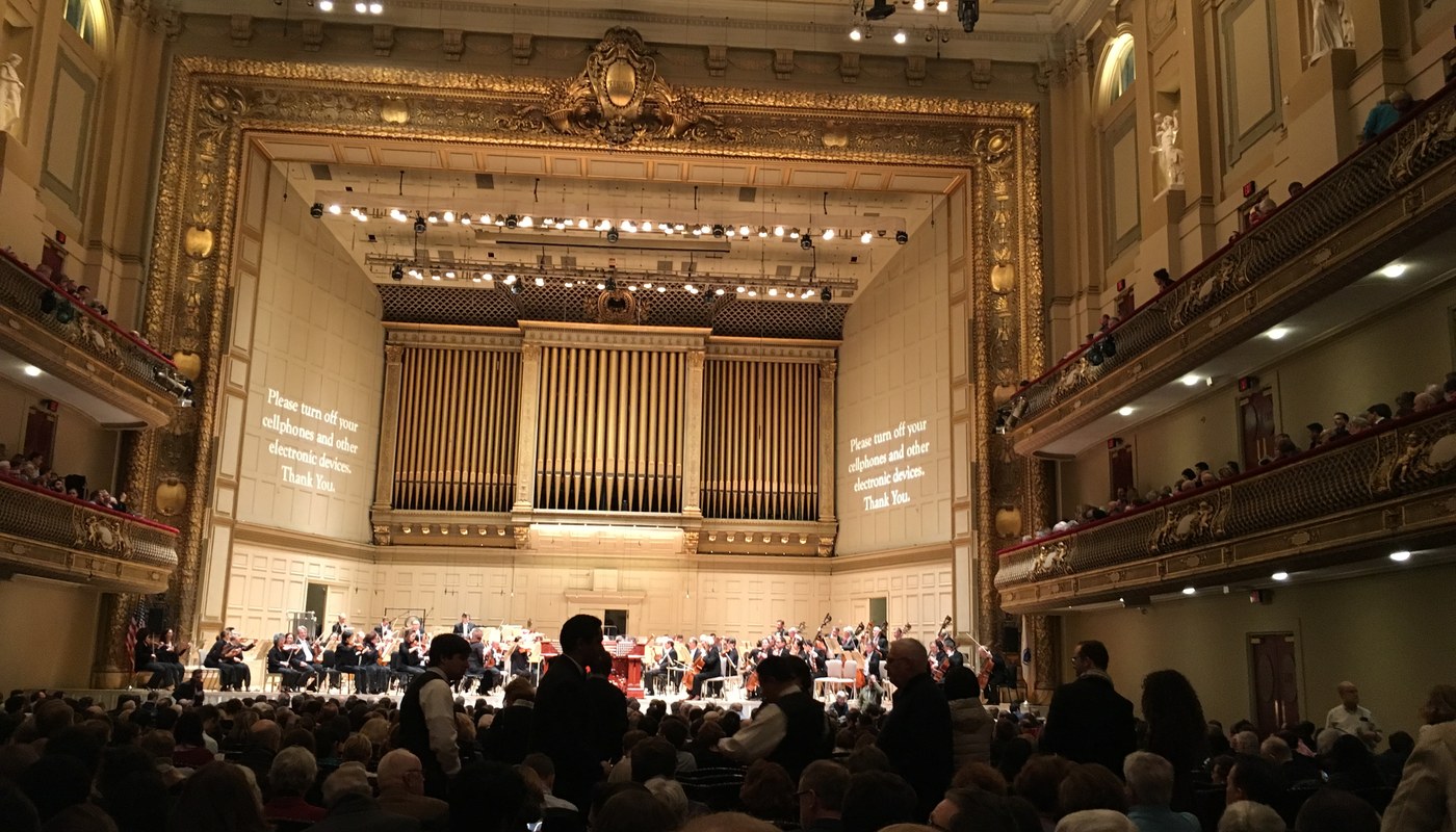 Audience seated inside Boston Symphony Hall